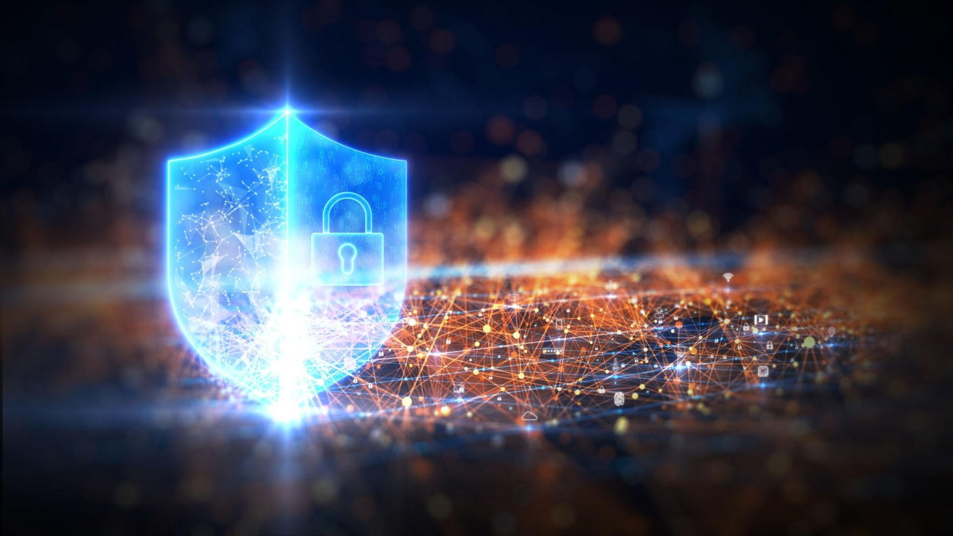 Glowing blue shield with padlock icon representing cybersecurity and digital data protection on dark background